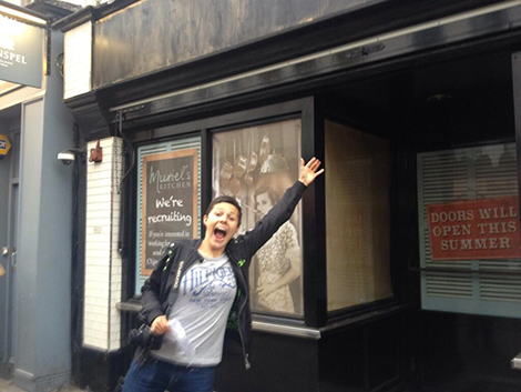Diana in front of the sign for Muriel's Kitchen Diana in front of the sign for Muriel's Kitchen
